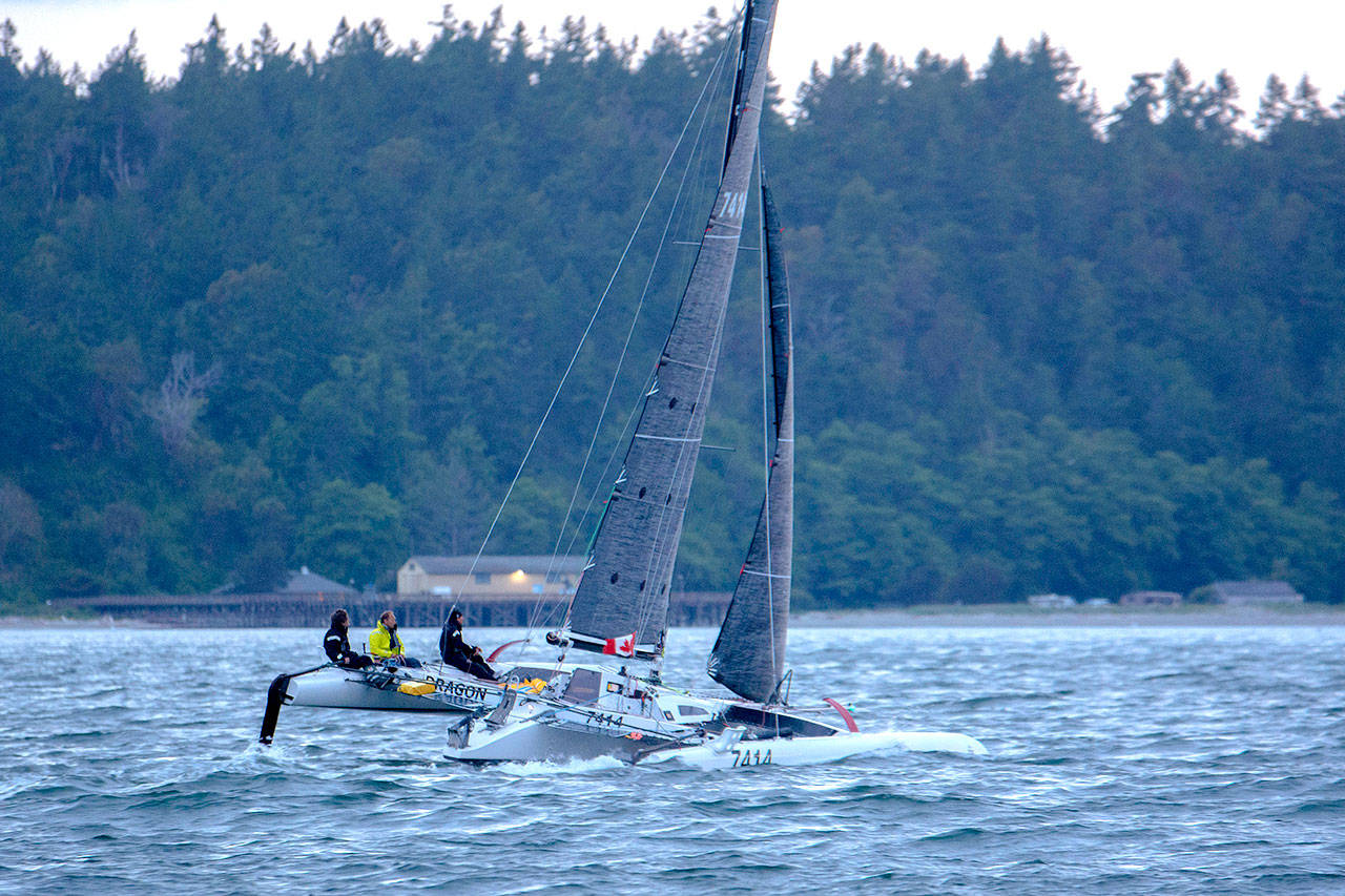 Team Pear Shaped Racing sails in the Race to Alaska on Monday morning. (Jesse Major/Peninsula Daily News)
