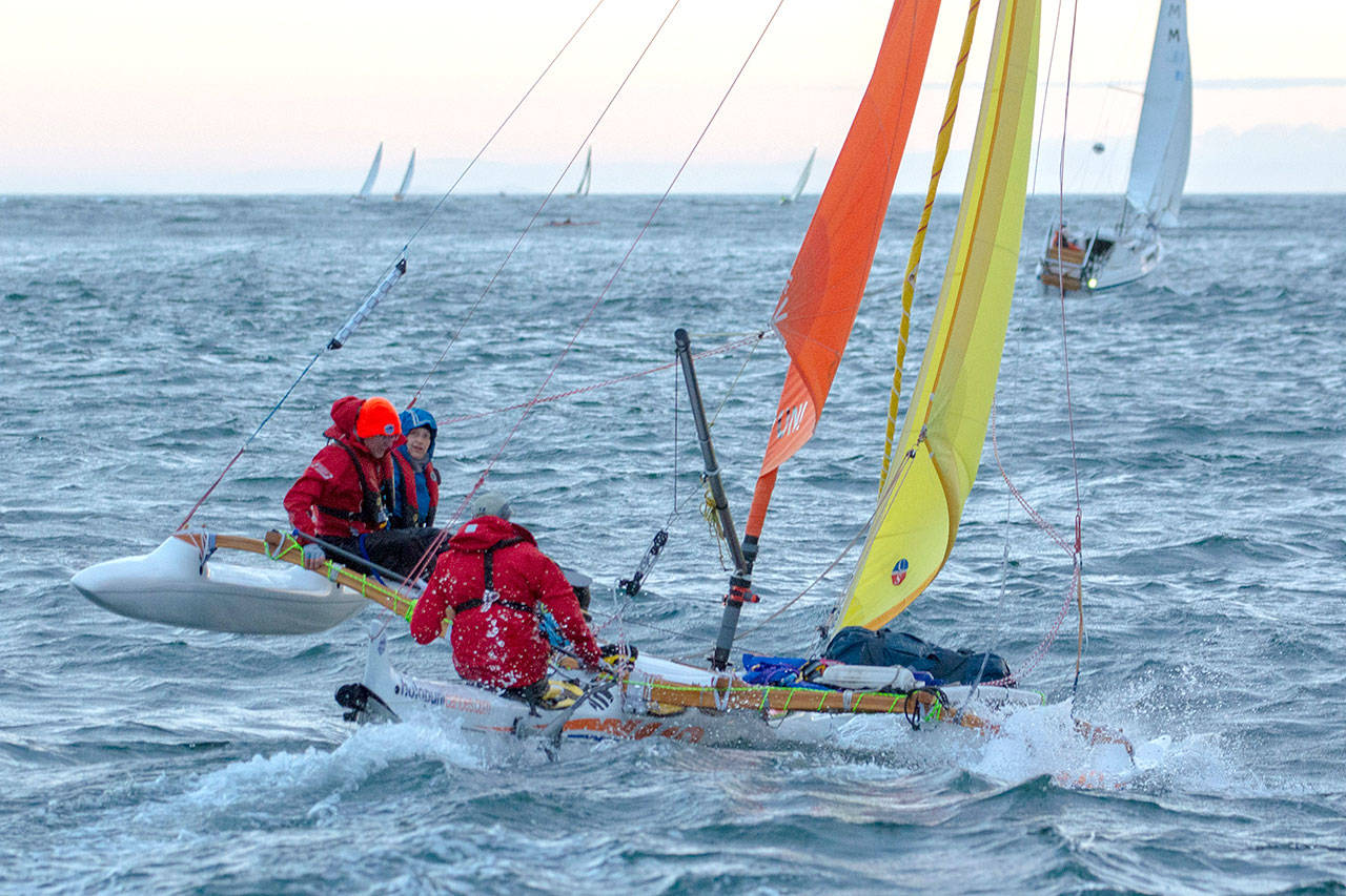 Team Holopuni sails during the first leg of the Race to Alaska Monday morning. (Jesse Major/Peninsula Daily News)