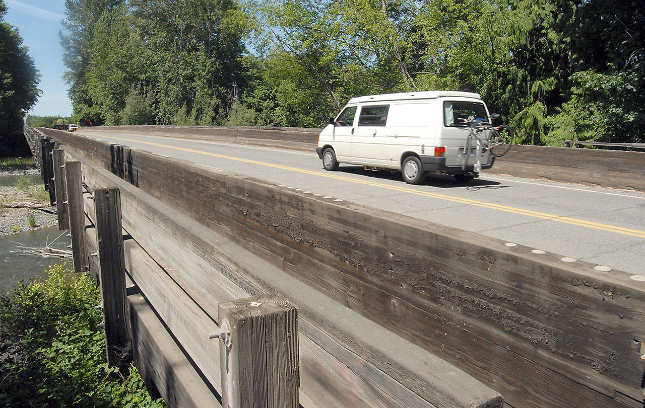 A van makes its way over the Woodcock Road bridge over the Dungeness River near Ward Road north of Sequim on Tuesday. (Keith Thorpe/Peninsula Daily News)