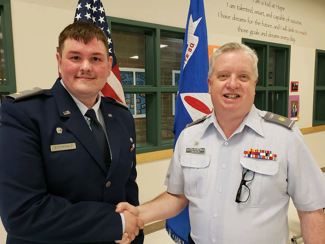 1st Lt. Darren Fitzgerald, left, relieves Maj. Mark Swanson, CAP, of command of the Dungeness Composite Squadron of the Civil Air Patrol in late May. Submitted photo