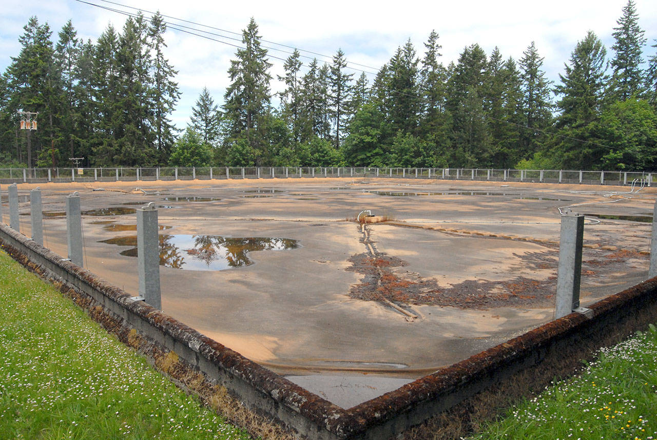 The Peabody Heights Reservoir, shown Saturday with rainwater pooled on its protective cover, sits nearly full at the end of East Viewcrest Avenue in Port Angeles. (Keith Thorpe/Peninsula Daily News)