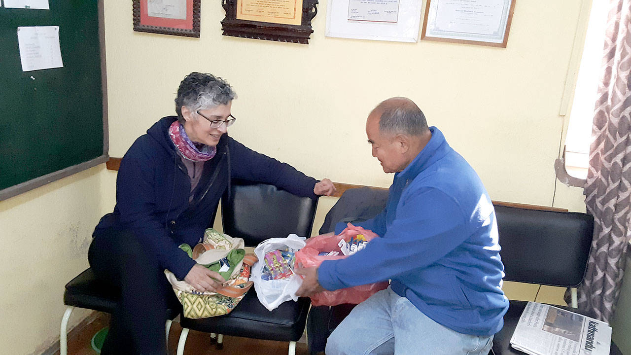 Alicia Jean Demetropolis, Global Humanity Initiative president, with Dr. Kulesh Thapa, medical director of the Chhatrapati Free Clinic in Katmandu, Nepal, with the first donated toothbrushes.