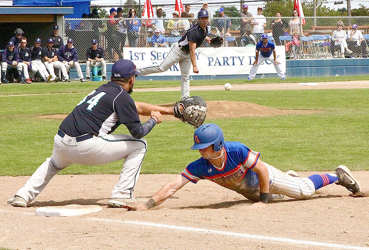 <strong>Dave Logan</strong>/for Peninsula Daily News                                Bellingham Bells pitcher Matt Henckel tries to pick off Lefties baserunner Justin Fuggitt at first base Sunday. The Bells’ first baseman Derek Marshall is in on the play.