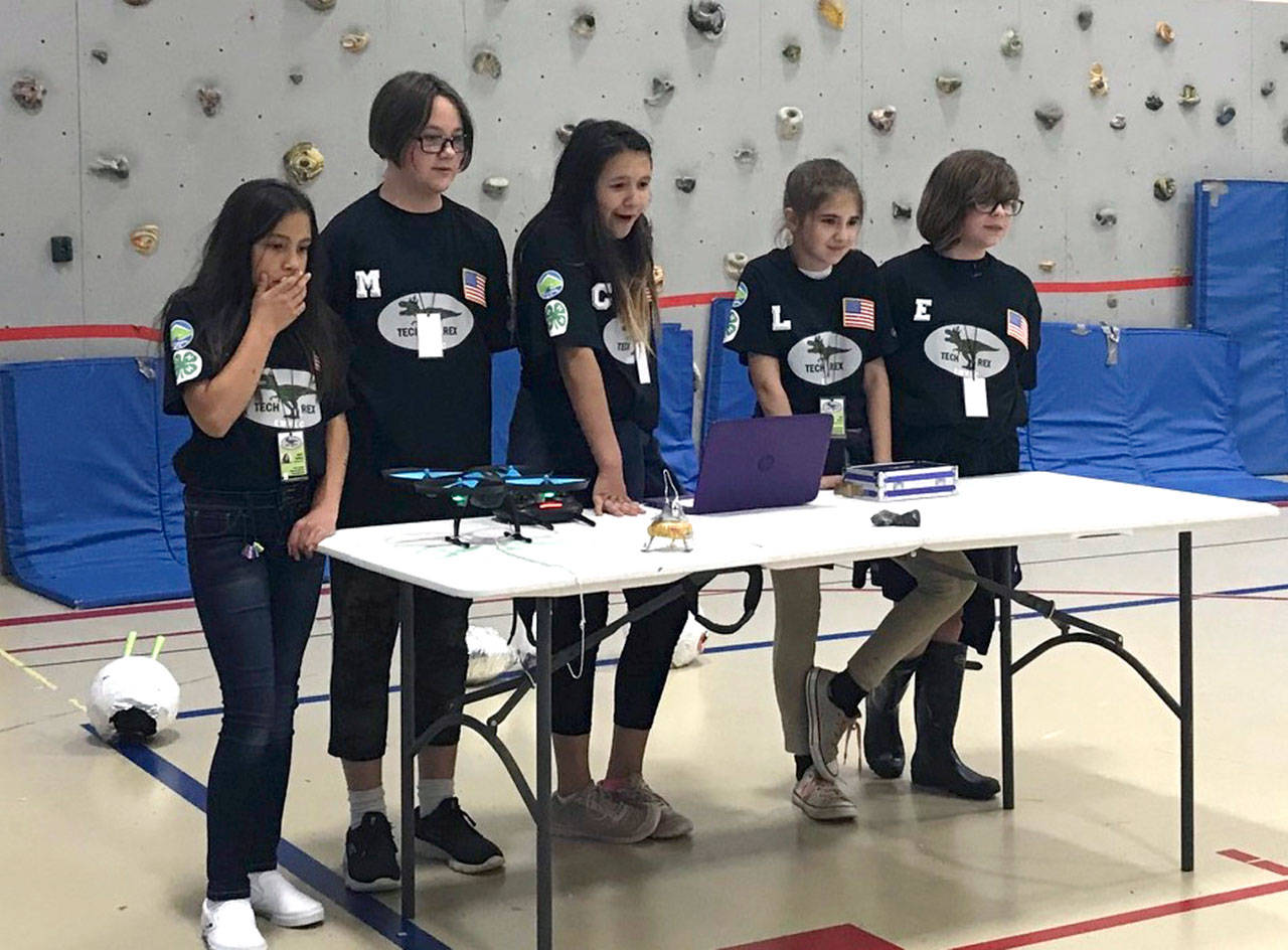 From left, Hailey Charles, Mackenzie Pearcy, Chasity Matson, Lily Meyer and Ember Runion formed Team TechRex, a Clallam County 4-H group of fifth-graders from Dry Creek Elementary School in Port Angeles that won the 33-team Olympic Peninsula NASA Challenge. They will compete along with Team W.O.W. Women of the World from Forks Intermediate on July 19 in a regional event at the University of Washington in Seattle. (Melanie Greer)