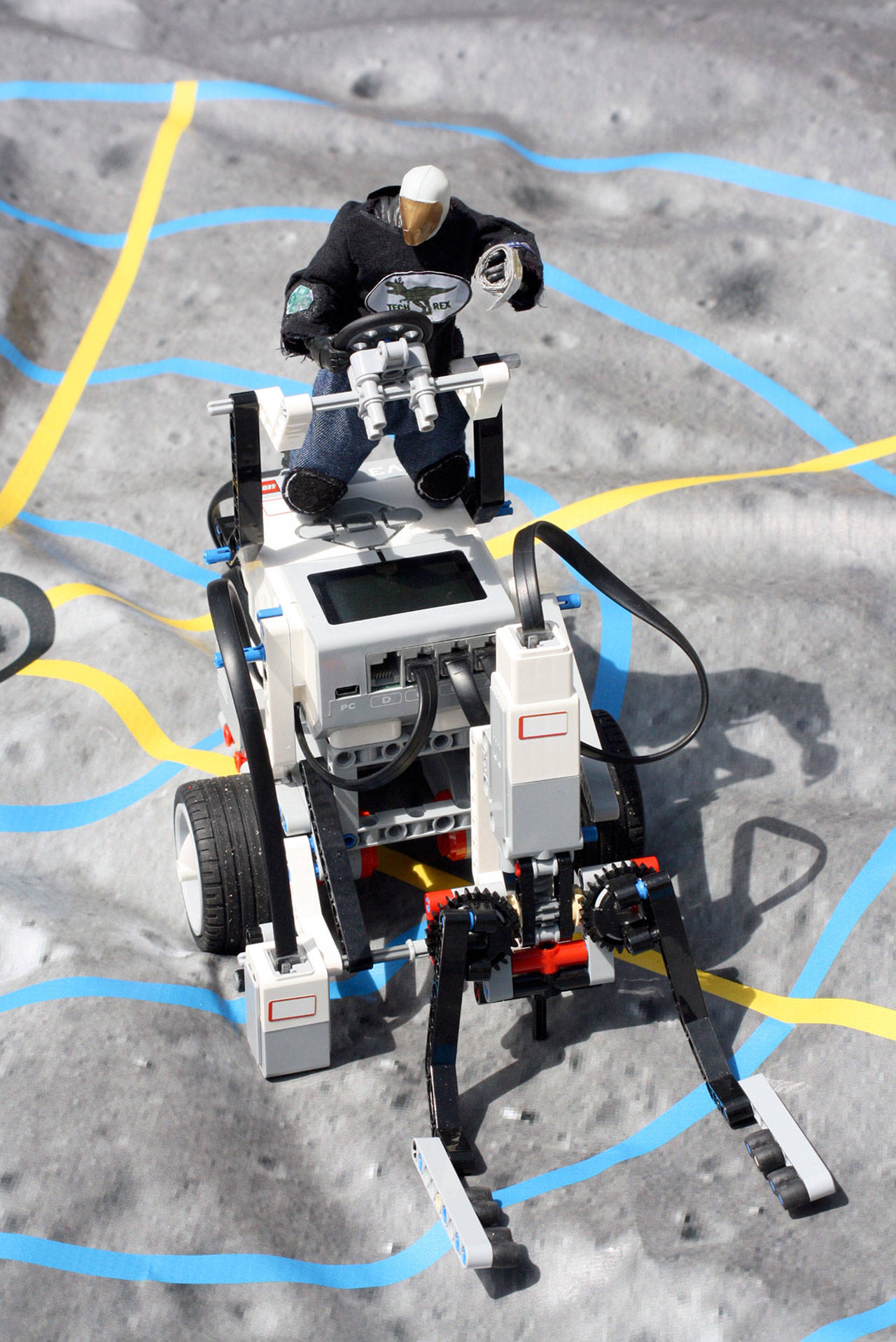 The Team TechRex astronaut sits atop the Lego Mindstorm rover with a symbolic roll of duct tape attached to its hand. (Melanie Greer)