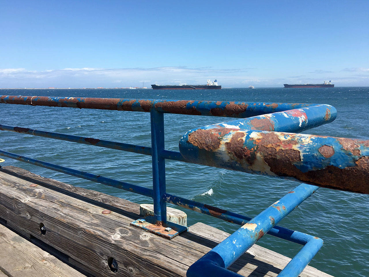 The Port Angeles City Pier railing is shown rusting and peeling Wednesday. (Rob Ollikainen/Peninsula Daily News)