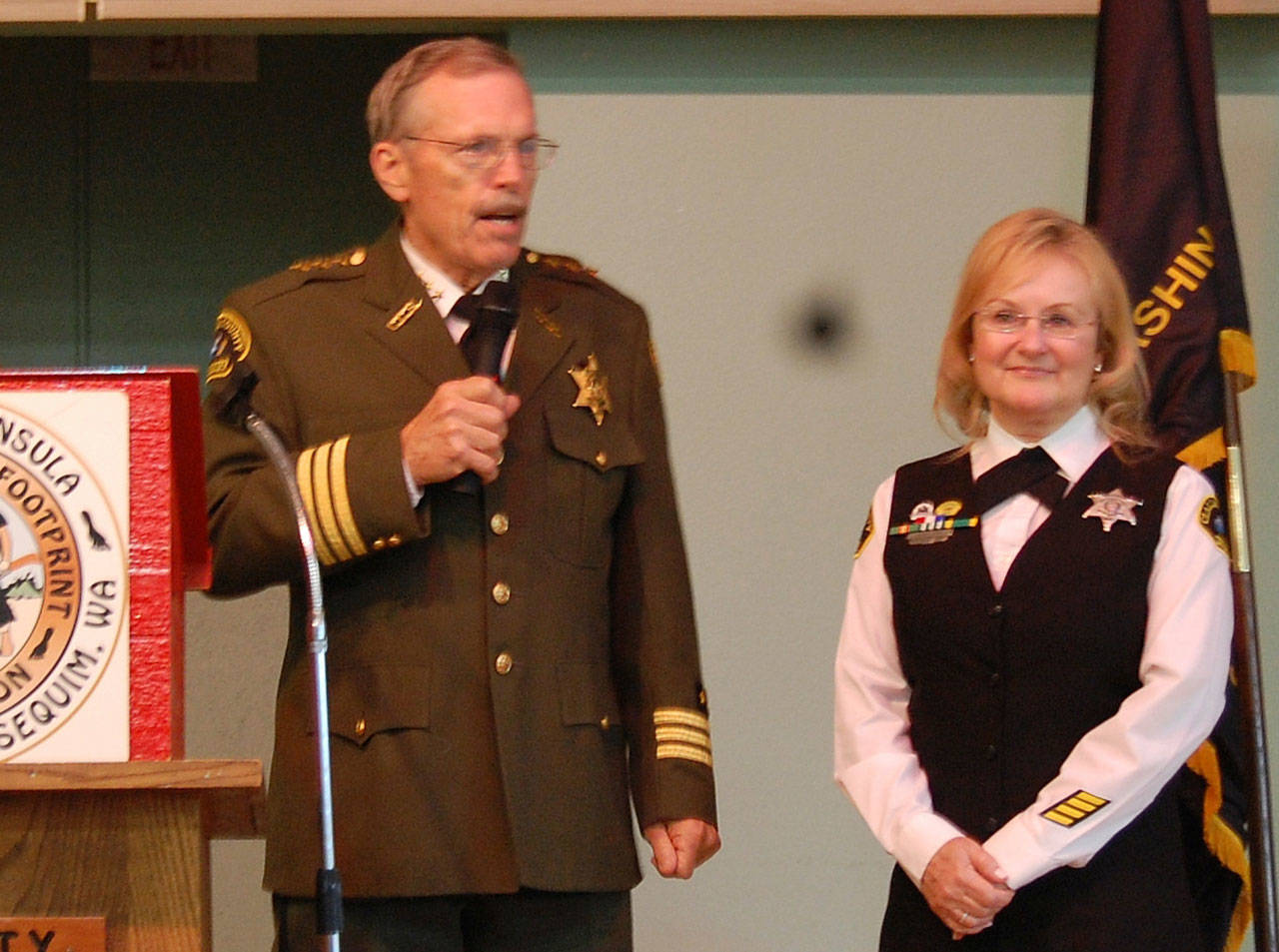 Clallam County Sheriff Bill Benedict congratulates Sylvia Orth, Footprinters of Olympic Peninsula Chapter 74’s 2018 Officer of the Year. Submitted photo                                Clallam County Sheriff Bill Benedict congratulates Sylvia Orth, Footprinters of Olympic Peninsula Chapter 74’s 2018 Officer of the Year.