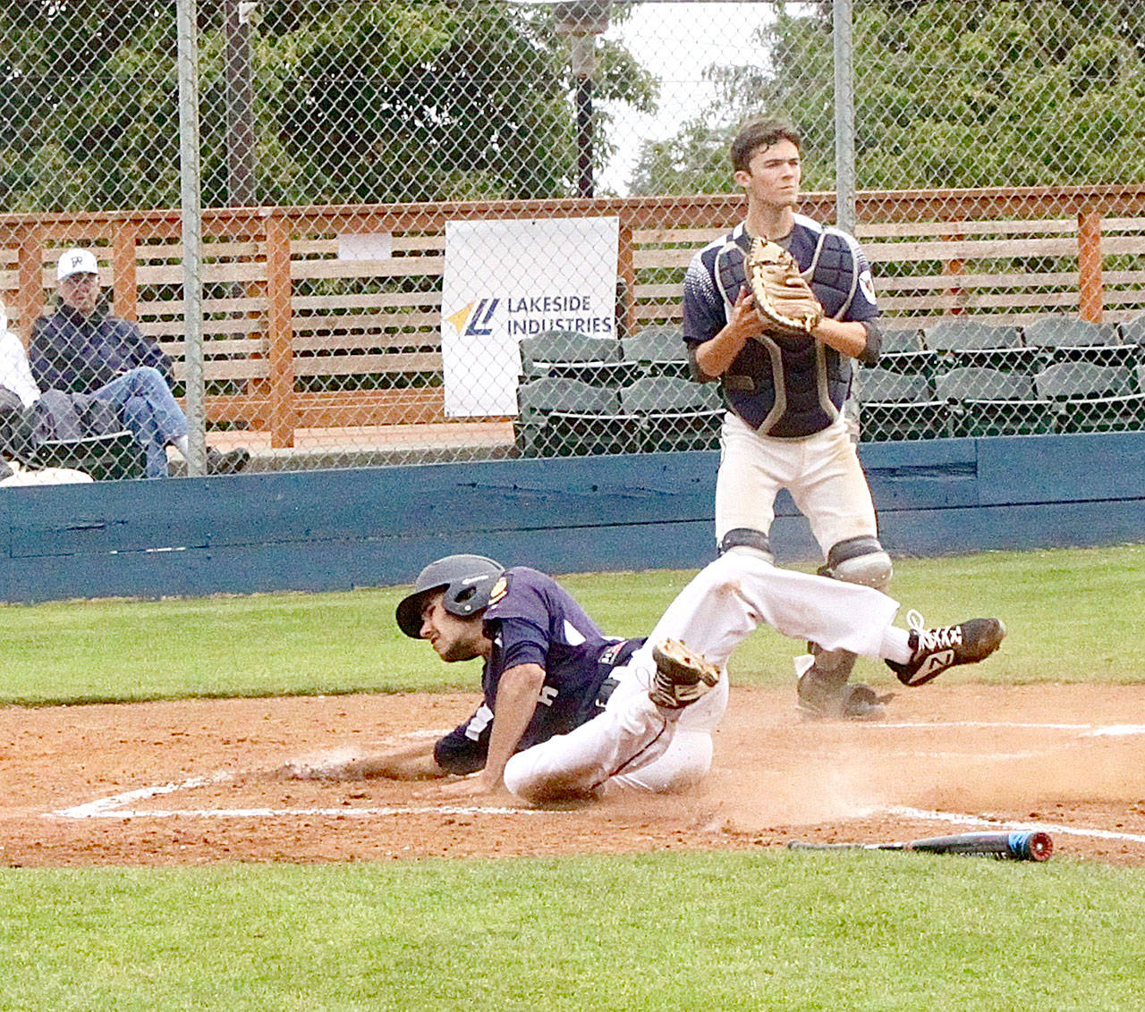 Wilder Senior’s Gavin Guerrero slides safely home for a run against Snohomish on Saturday. Wilder swept two games 11-3 and 13-1 as Guerrero had five hits and four runs scored on the day. (Dave Logan/for Peninsula Daily News)