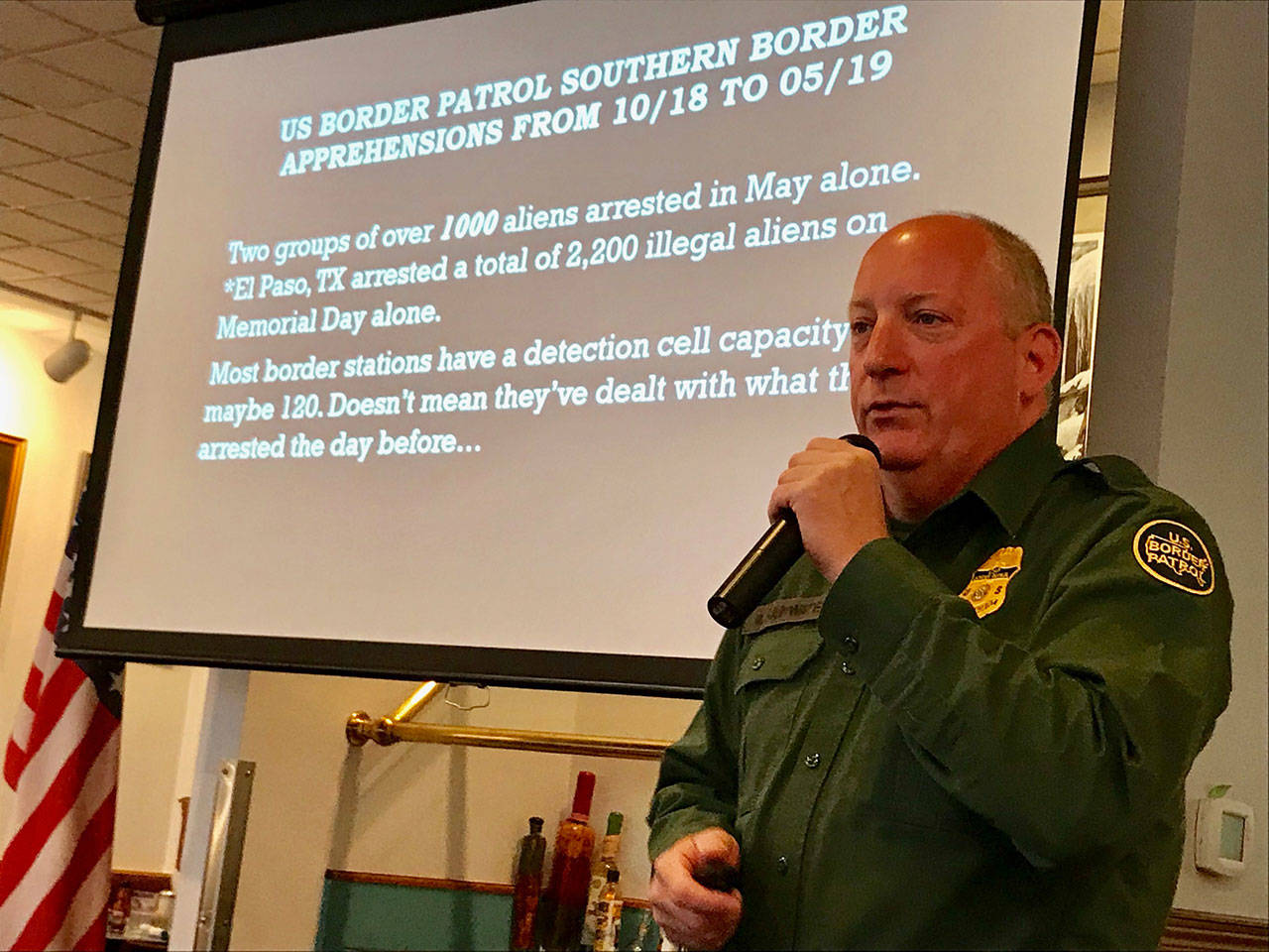 Border Patrol Agent Matthew Rainwater, who recently returned from 30 days of duty on the southern border, reviewed the agency’s challenges during a presentation Tuesday. (Paul Gottlieb/Peninsula Daily News)