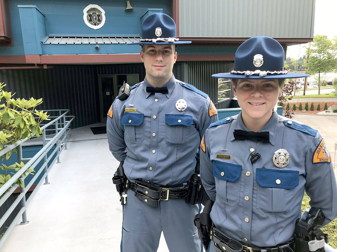 New Washington State Patrol District 8 Troopers Gabriel Krebs, left, and Rachel Kemp when they reported in to their assignments after graduation. (Washington State Patrol)