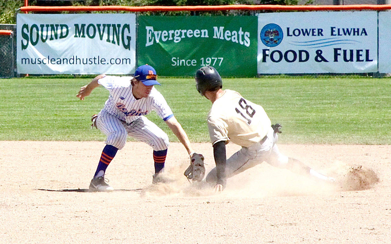 Chase Fernlund of the Bend Elks slides safely into second base just ahead of the tag by Lefties’ shortstop Trevor Rosenberg on Sunday at Civic Field. (By Dave Logan/for Peninsula Daily News)