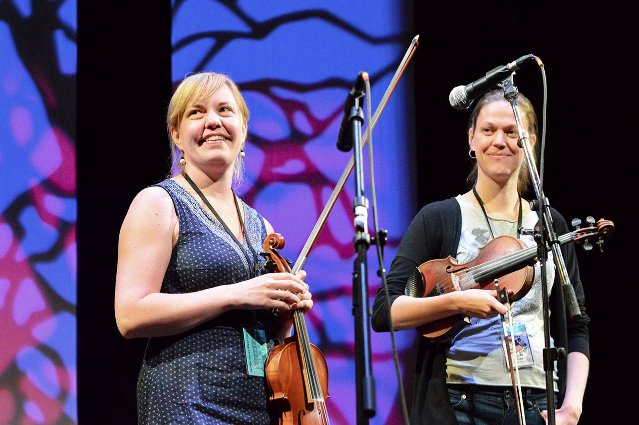 Anna Lindblad, left, and Elise Wessel Hildrum are part of Fru Skagerrak, a Swedish-Norwegian-Danish trio appearing in Saturday afternoon’s Fiddle Tunes Finale at Fort Worden. (Diane Urbani de la Paz/for Peninsula Daily News)