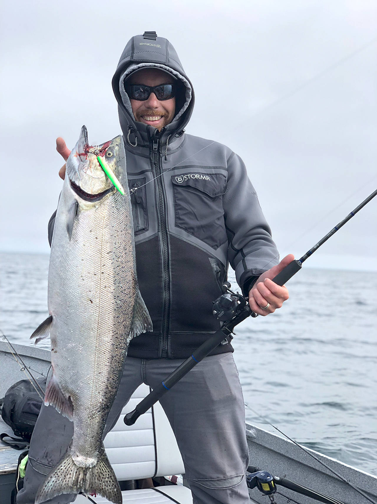 Pete Rosko Roger Ross caught this chinook off Port Angeles using a 1 1/2-ounce lime white pearl Kandlefish. The tanker ship captain hauled the king of the day Monday, the opening day of salmon season in Marine Area 6.