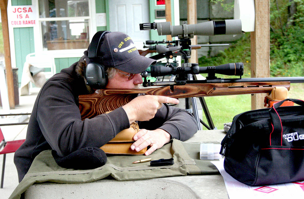 Michael Legarsky of Port Townsend fires .308 Winchester rounds Wednesday at the 100-yard rifle range at the Jefferson County Sportsmen’s Association. The club has been awarded a state Recreation and Conservation grant for $150,000 toward a $236,000 project to install two noise-abatement and projectile-control stalls that will capture the rifle sounds and direct them to the ground, association Vice President Don McNees said. (Brian McLean/Peninsula Daily News)