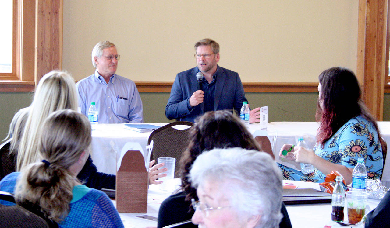 State Reps. Steve Tharinger, D-Port Townsend, left, and Mike Chapman, D-Port Angeles, speak Monday during the Chamber of Jefferson County’s legislative luncheon at the Fort Worden Commons in Port Townsend. (Brian McLean/Peninsula Daily News)