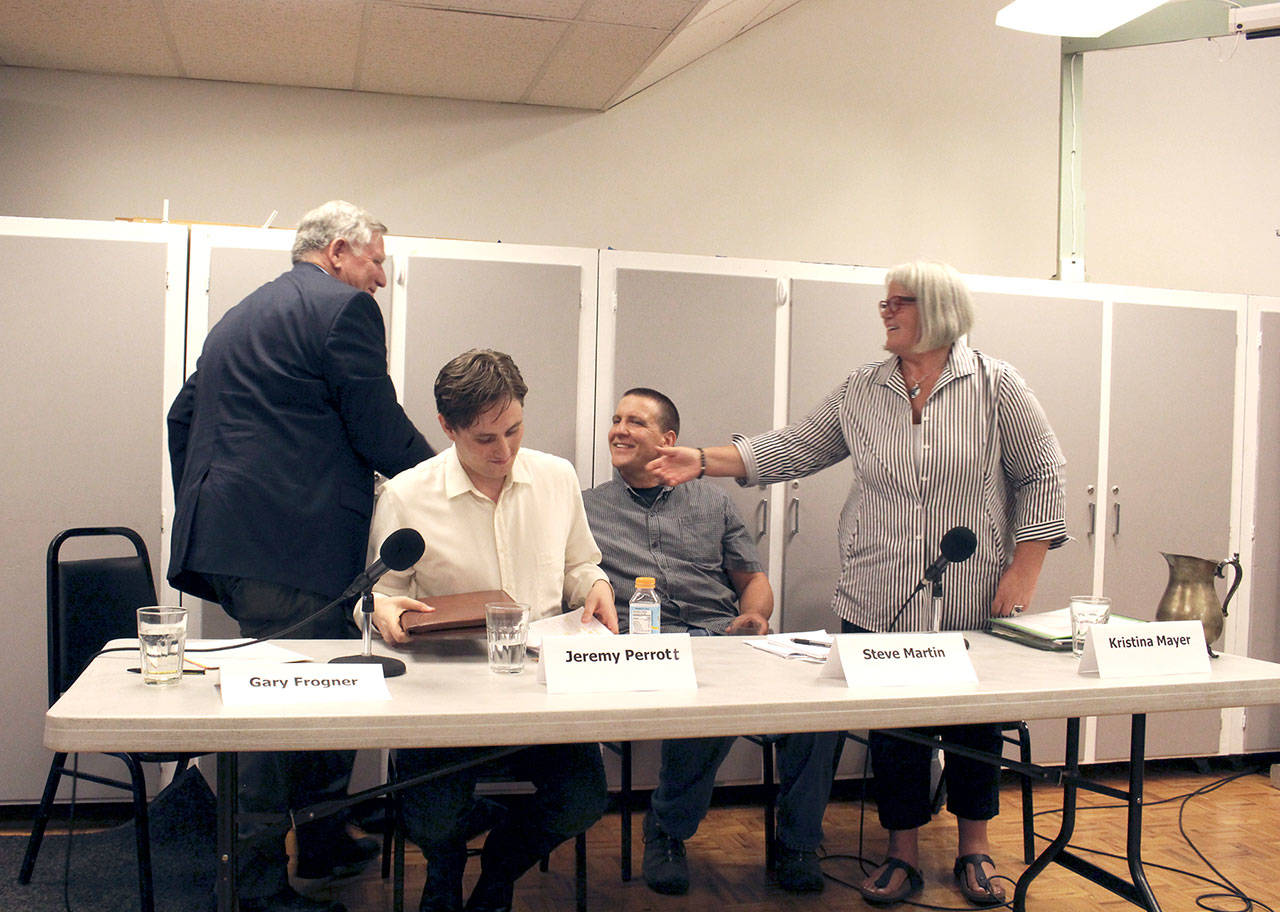 The four candidates for the District 3 Chimacum School Board position congratulate each other at the end of a candidate forum put on by the Jefferson County League of Women Voters. (Zach Jablonski/Peninsula Daily News)