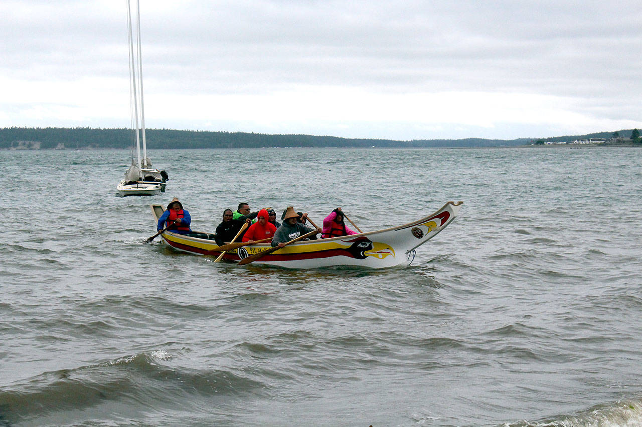 The Quileute canoe Well Being paddles to shore in Port Townsend among strong winds and drizzling rain. (Zach Jablonski/Peninsula Daily News)                                The Quileute canoe “Well Being” paddles to shore in Port Townsend amid strong winds and drizzling rain. (Zach Jablonski/Peninsula Daily News)