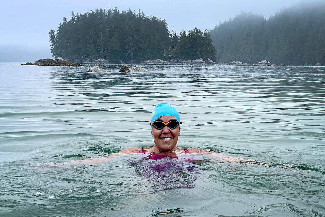 Susan Simmons swims in the Koeye River in June. She plans to swim across the Strait of Juan de Fuca on Sunday. (Corey Teramura)