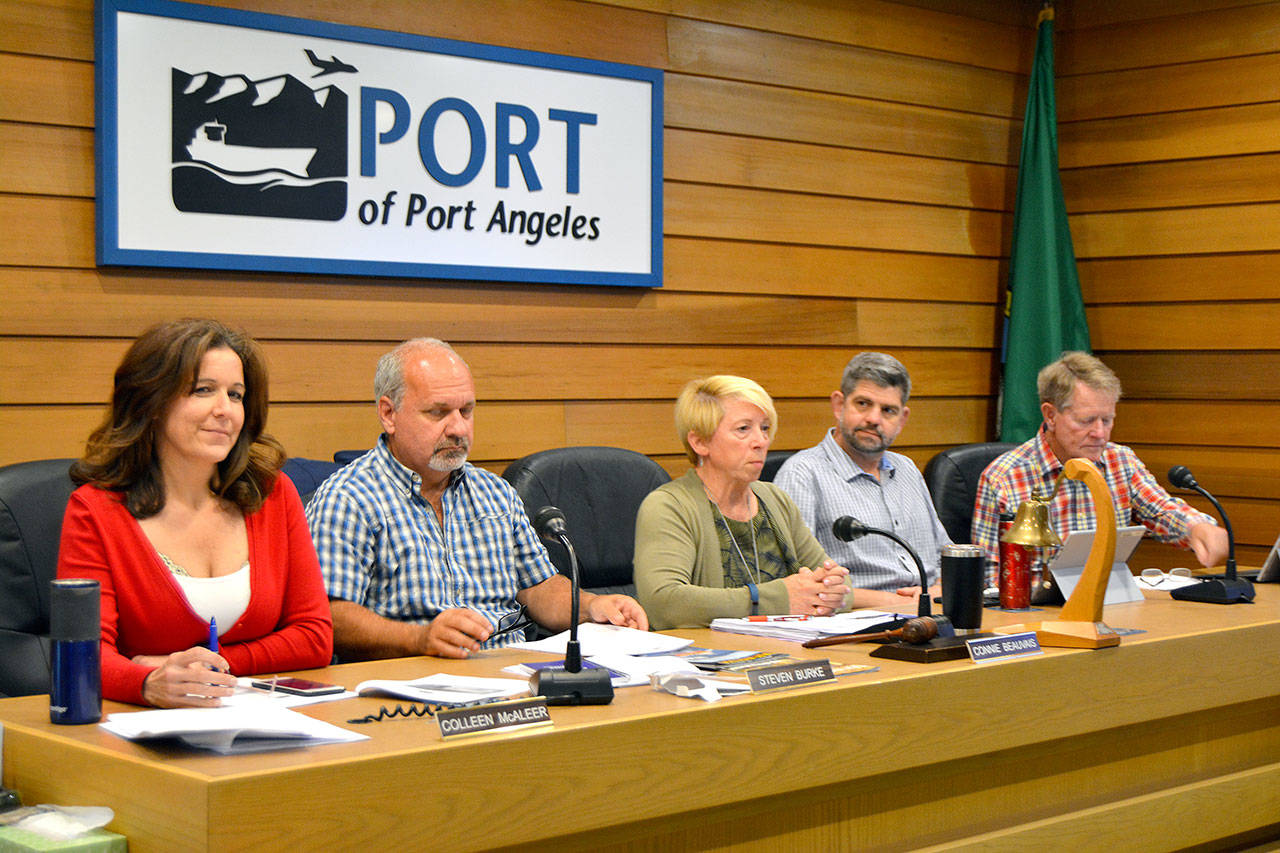 A joint meeting Monday brought together, from left, Port of Port Angeles Commisioners Colleen McAleer, Steven Burke and Connie Beauvais and Clallam County Commissioners Mark Ozias and Randy Johnson. (Paul Gottlieb/Peninsula Daily News)