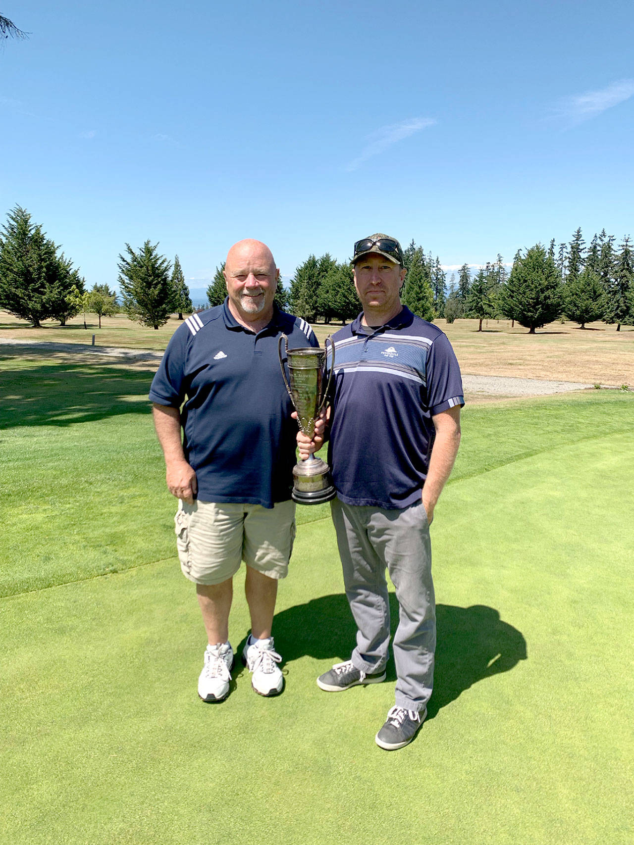 Peninsula Golf Club recently held its annual Men’s Club Championship and Paul Reed, left, and Mark Mast, won the Gross and Net championships, respectively and will share the Thomas T. Aldwell Trophy. It was the 12th club championship for Reed, the first for Mast.