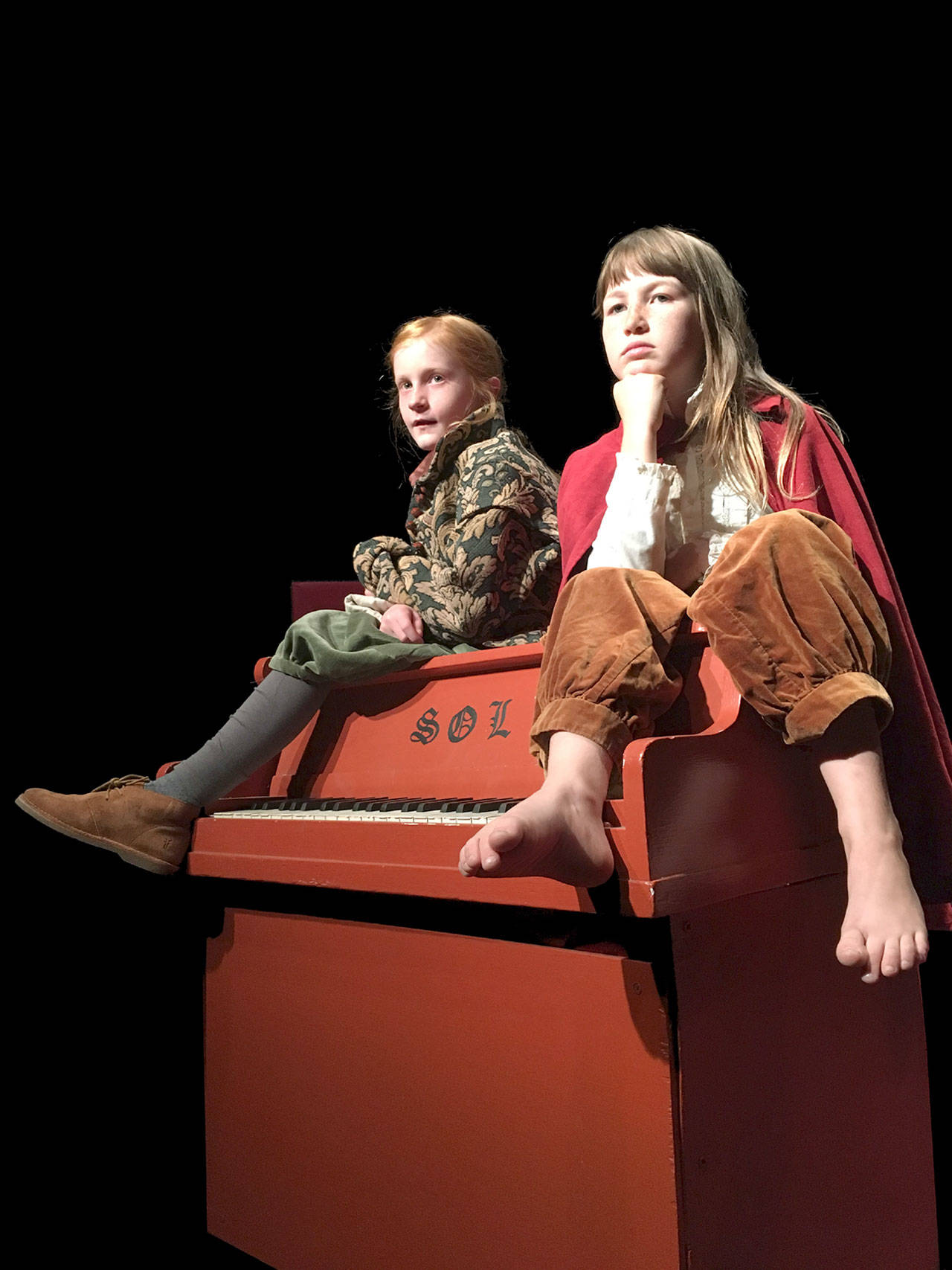 Anora Kuzma and Kaylee Klebanow are shown in a scene from “When You Tell the Moon About Gravity,” which runs this weekend at The Chameleon Theater in Port Townsend. (Sophie Pipia)