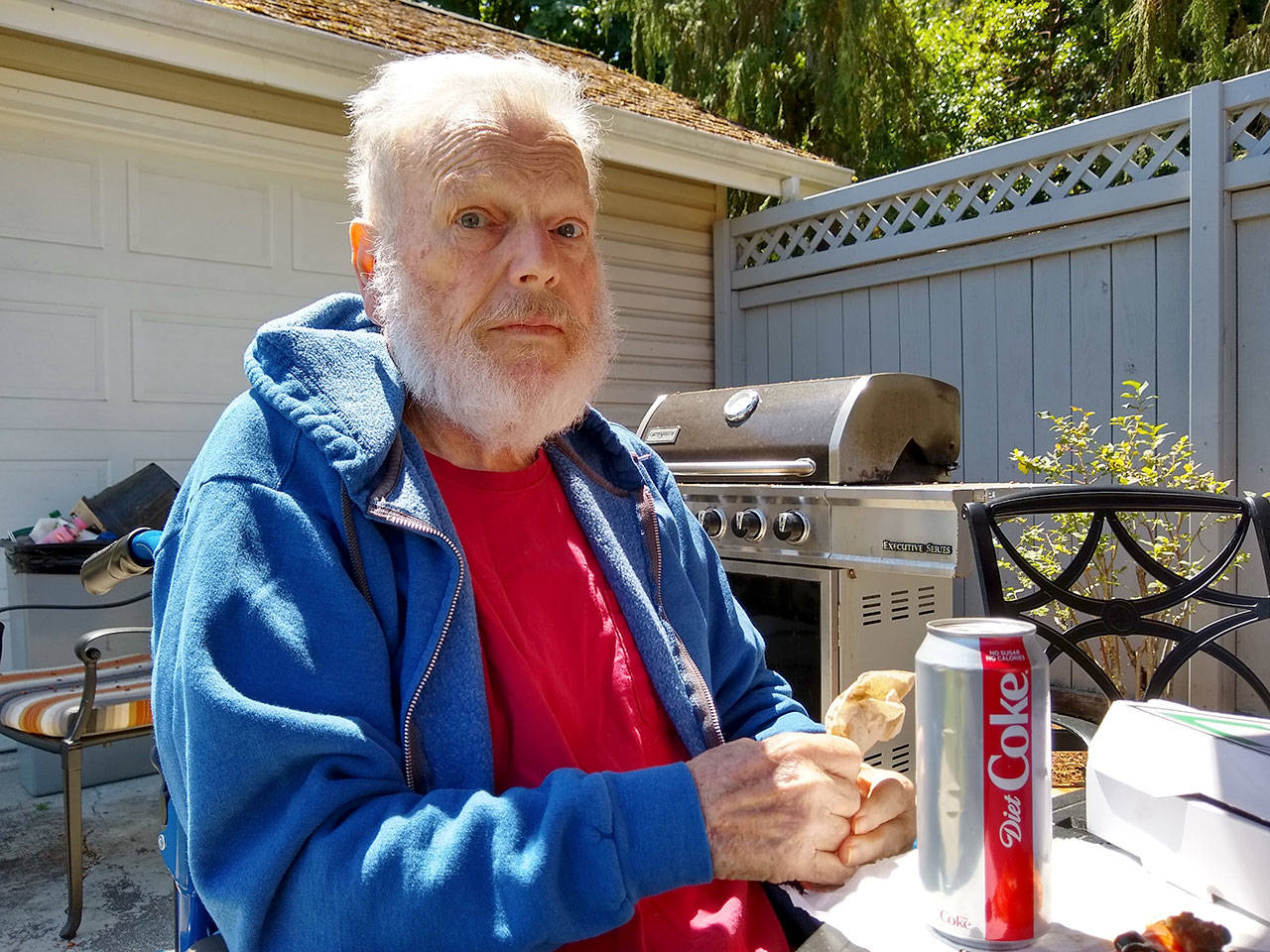 My dad, Eckart Sellinger, enjoying a pizza and soda in the backyard of his home in Port Angeles. (Zorina Barker/for Peninsula Daily News)
