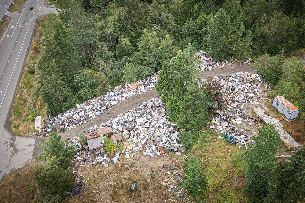 Midway Metals at 258010 U.S. Highway 101 is shown in this aerial photo. Clallam County is exploring ways to get the scrapyard property cleaned up. (Dave Pitman/Olympic Aerial Solutions)