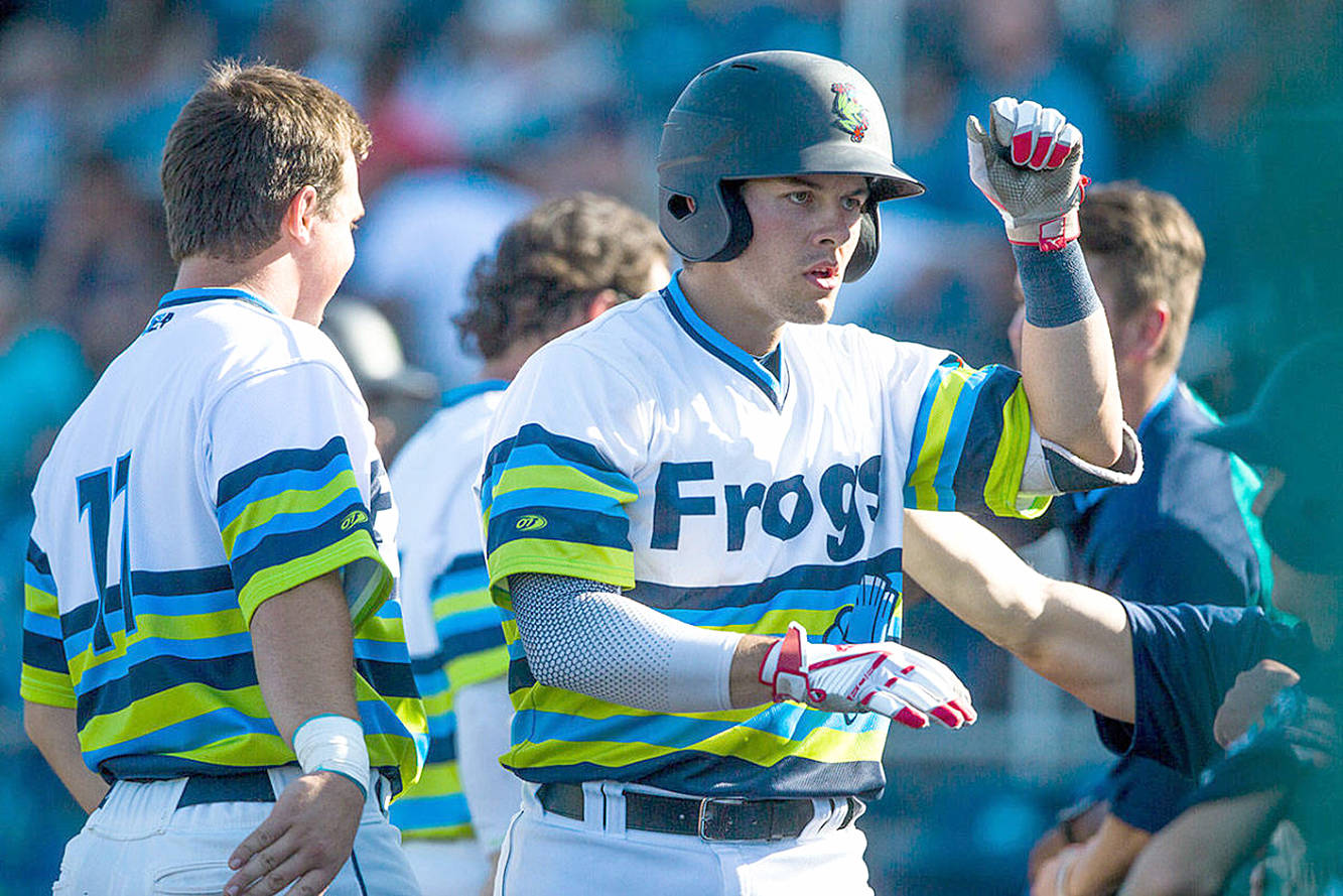 <strong>Olivia Vanni</strong>/The Daily Herald                                Everett AquaSox catcher Brennon ‘Benny’ Kaleiwahea gets high-fives from his teammates after hitting a home run Aug. 4 during a game against Spokane at Funko Field at Everett Memorial Stadium in Everett.