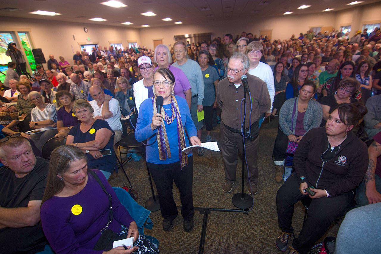 Wendy Goldberg, a member of Save our Sequim, was first to speak when the Jamestown S’Klallam Tribe opened the meeting to questions and statements from the public Thursday. (Jesse Major/Peninsula Daily News)