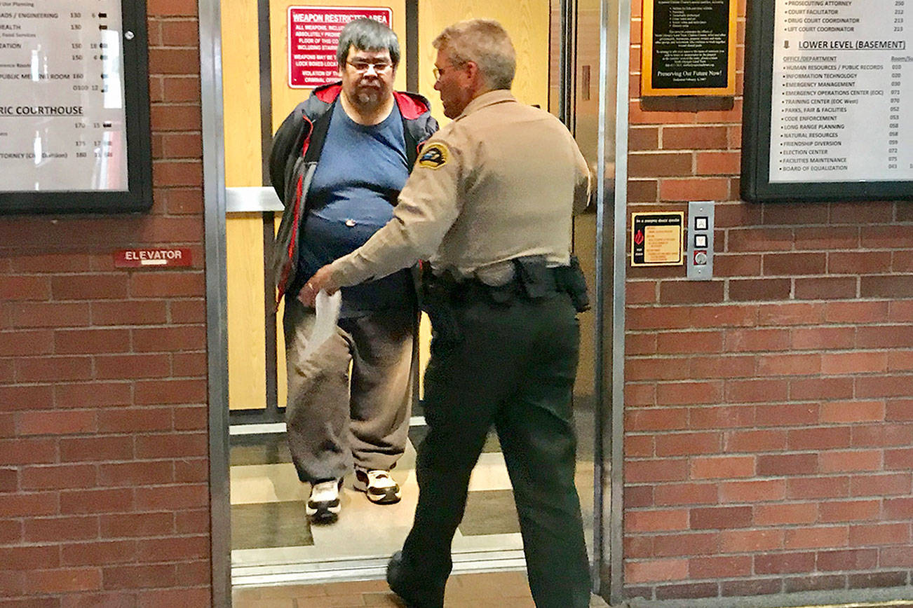 Eric Stacey Greene is led to the Clallam County jail after pleading guilty to child rape. (Paul Gottlieb/Peninsula Daily News)