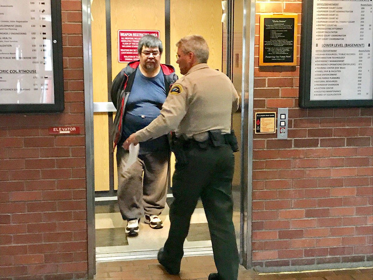 Eric Stacey Greene is led to the Clallam County jail after pleading guilty to child rape. (Paul Gottlieb/Peninsula Daily News)