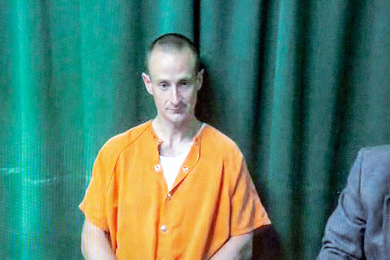 Joey Maillet, accused of driving heavy equipment into FREDS Guns in Sequim and stealing more than two dozen handguns, remained held in the Clallam County jail on a U.S. Marshal detainer after his state charges were dismissed Wednesday.