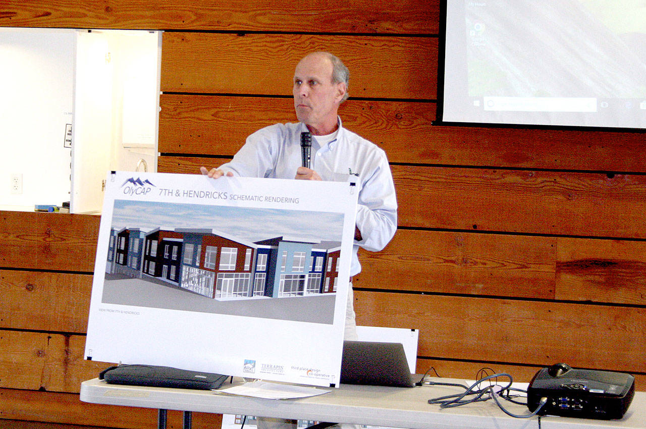 Mark Blatter of the Washington Low Income Housing Alliance provides details on behalf of Olympic Community Action Programs to the joint city-county housing and homeless housing task force at the Cotton Building in downtown Port Townsend. (Brian McLean/Peninsula Daily News)