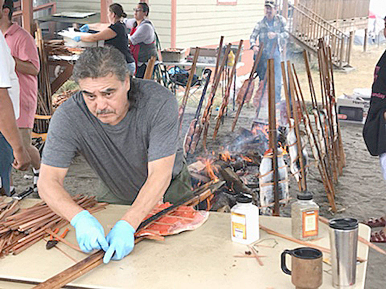 Monty McAlpin prepares sockeye salmon filets that were caught for the 2018 Makah Days salmon bake. (Paul Gottlieb/Peninsula Daily News)