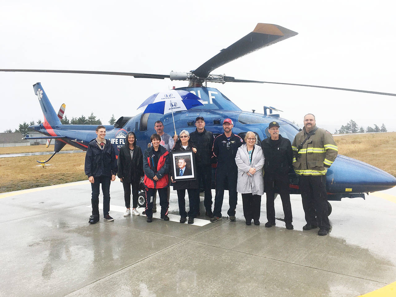Community members and dignitaries stand with Eagle Scout candidate Ben Wright, left, during Diamond Point Airports Airport Appreciation event on Aug. 10 that celebrated the completion of a new helipad. (Photo courtesy of Kaye Gagnon)