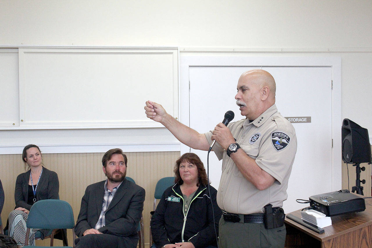 Jefferson County Sheriff Joe Nole answers questions about law enforcement response time in Gardiner and Discovery Bay at the Jefferson Board of County Commissioners Public Outreach Meeting in Gardiner. (Zach Jablonski/Peninsula Daily News)