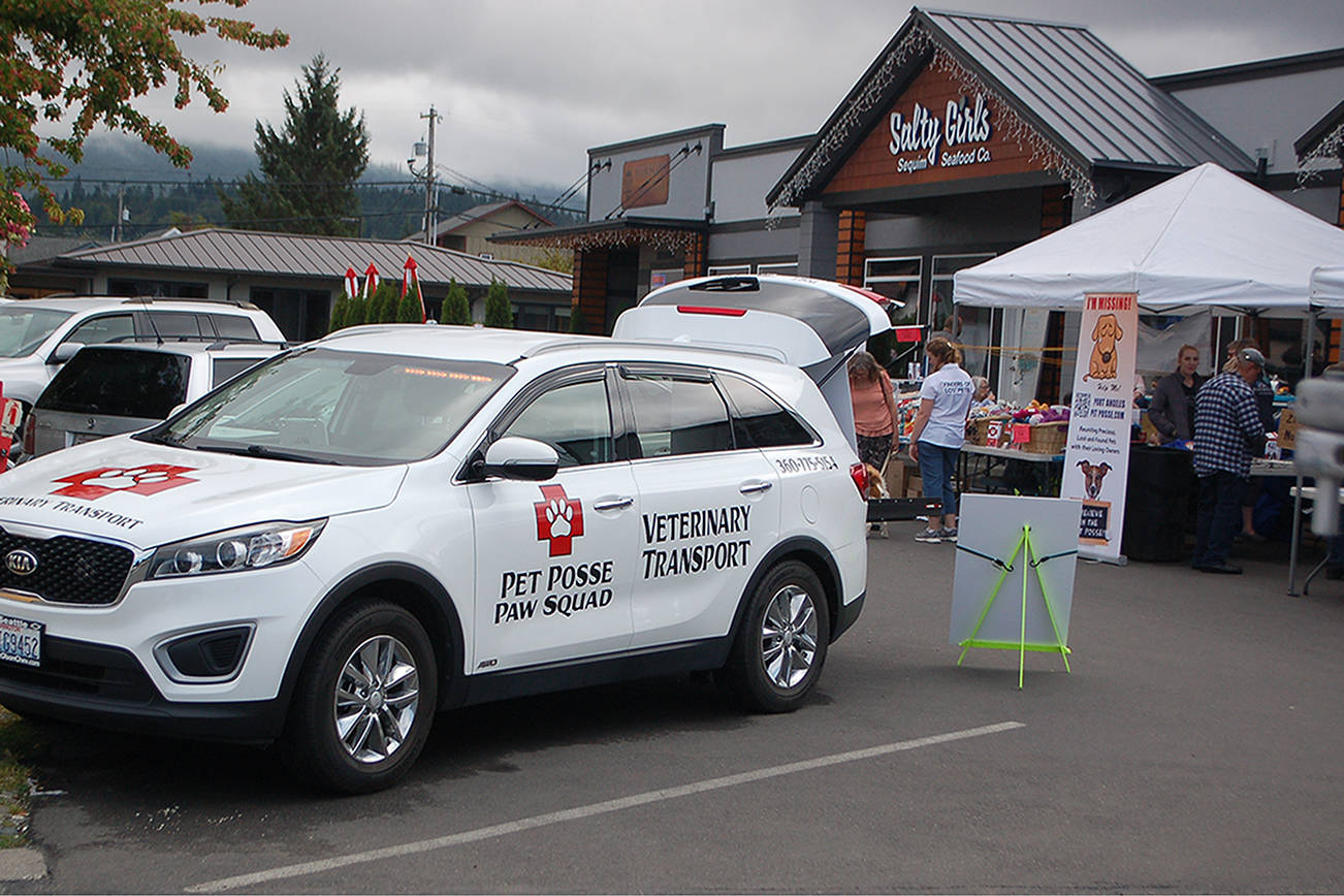 The Pet Posse veterinary transport vehicle parked in front of the Barks & Brews fundraiser event put on at the Peninsula Taproom on Aug. 10 to support the organization. Barks & Brews attracted more than 70 attendees and raised more than $5,000. Conor Dowley/Olympic Peninsula News Group