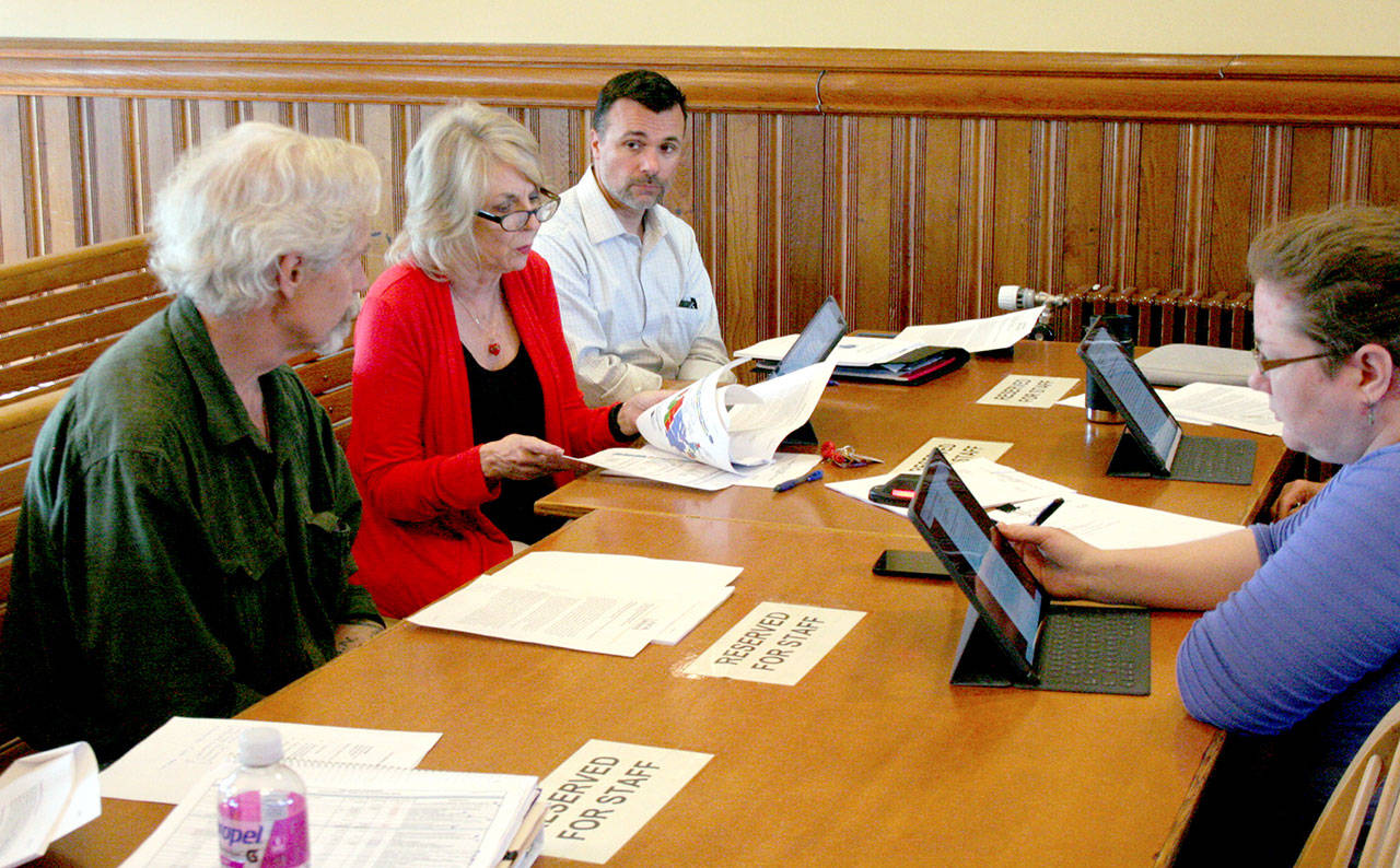 The Port Townsend finance and budget committee discusses a consultant’s report on the city-owned golf course Monday. The committee includes, from left, City Council member Bob Gray, interim City Manager Nora Mitchell, Parks and Recreation Director Alex Wisniewski and City Council member Amy Howard, the committee chair. Mayor Deborah Stinson also sits on the committee. (Brian McLean/Peninsula Daily News)