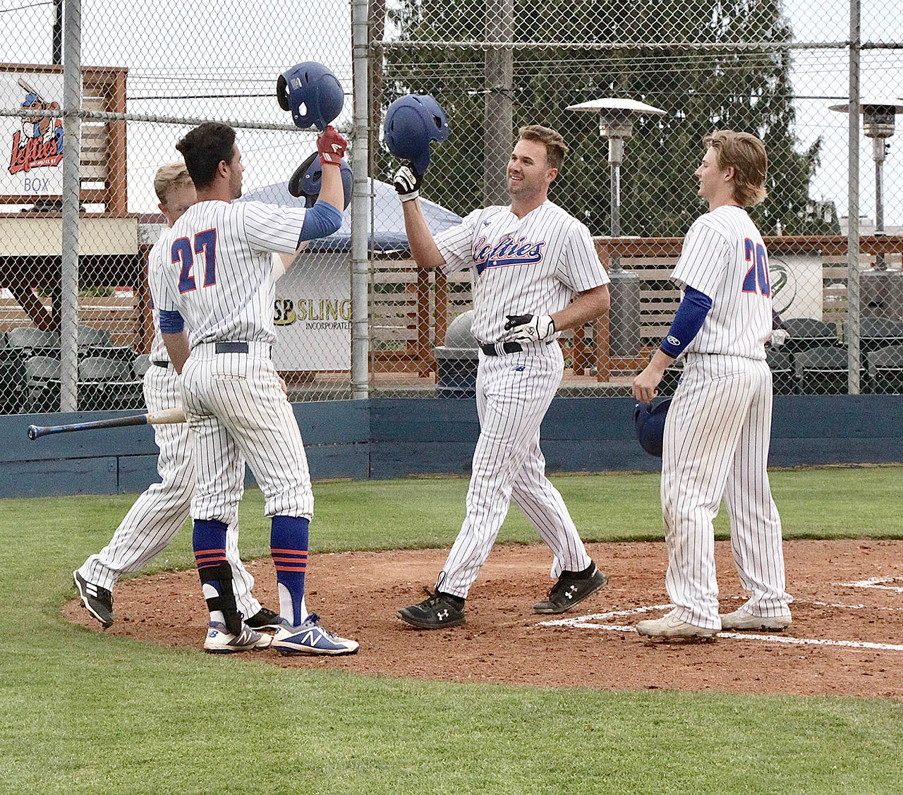 <strong>Dave Logan</strong>/for Peninsula Daily News                                The Lefties’ Matthew Christian, center, led the WCL with 12 home runs. He also slugged .711 on the season. The Campbell University senior was named to the All-WCL first team.