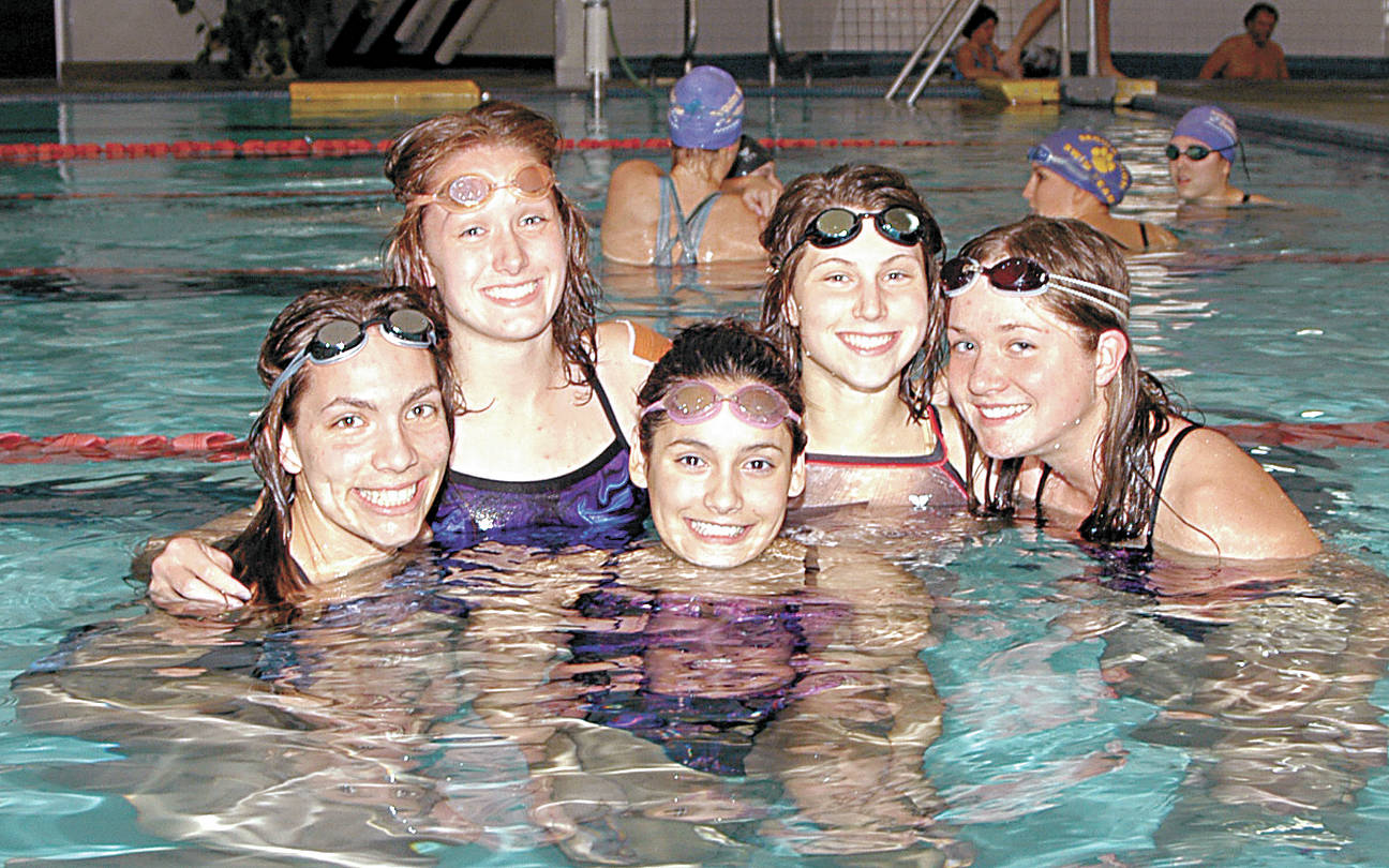 Sarah Thorson (nee Moores), second from left, joins other Sequim High swimmers who qualified for the 2006 state 2A meet, including (from left) Mackenzie Marmol,Rebekah Harasick, Justine Textor and Staci Stratton. Thorson was selected the new Sequim girls swim coach earlier this year. (Sequim Gazette file photo by Michael Dashiell)