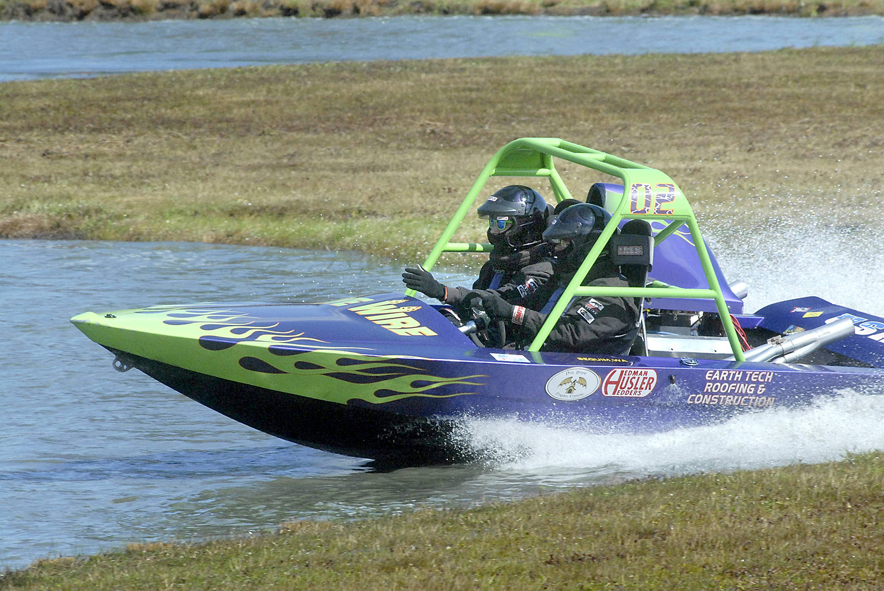 <strong>Keith Thorpe</strong>/Peninsula Daily News                                The Live Wire 02 400-class sprint boat, piloted by Vaughan Trapp, right, and navigated by Matt Denson, speeds through the course during July’s sprint boat race at Extreme Sports Park in Port Angeles.