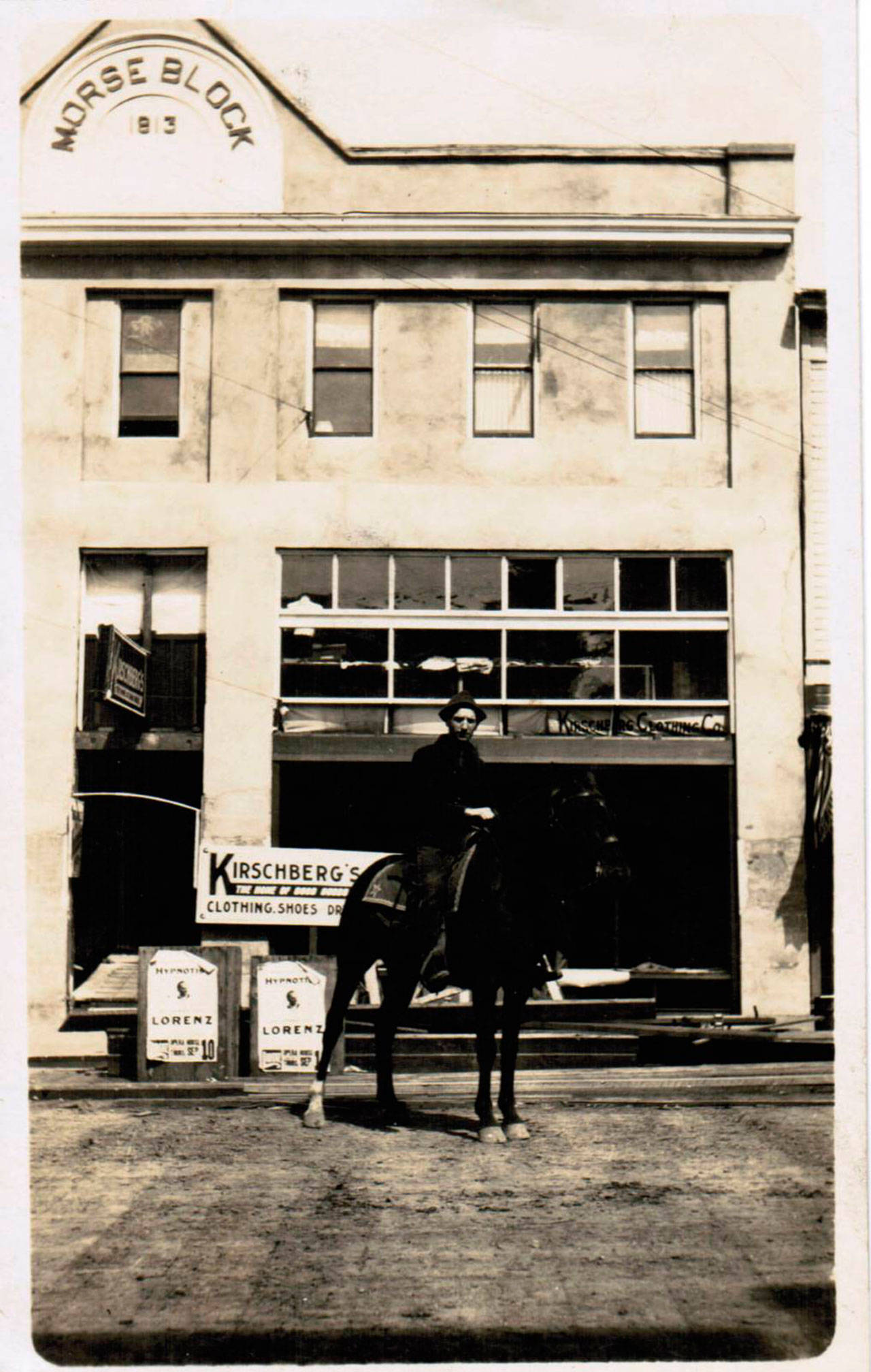 The D.W. Morse building is shown on a postcard in 1914 with Morse astride a horse in front. (John McNutt collection)