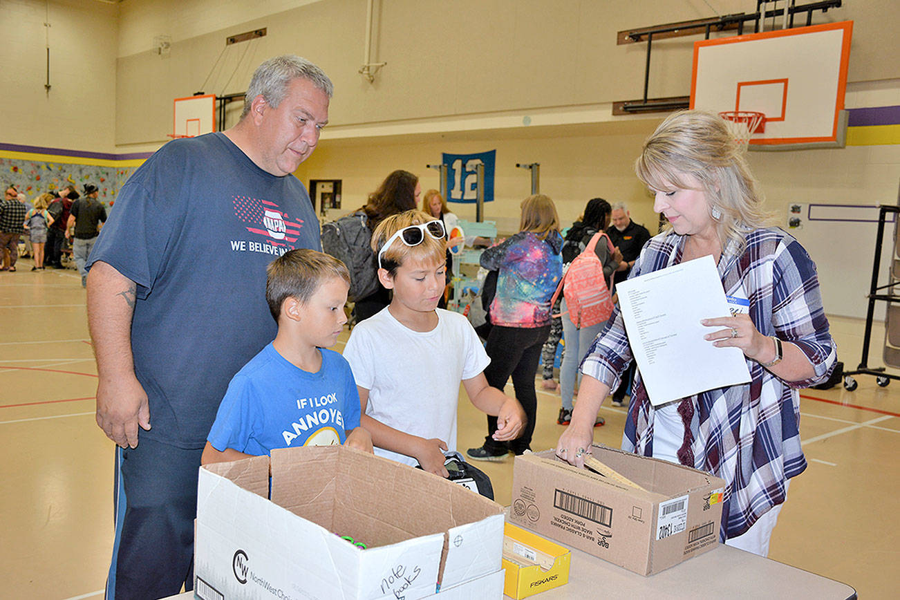 More than 950 local students receive supplies at back-to-school event
