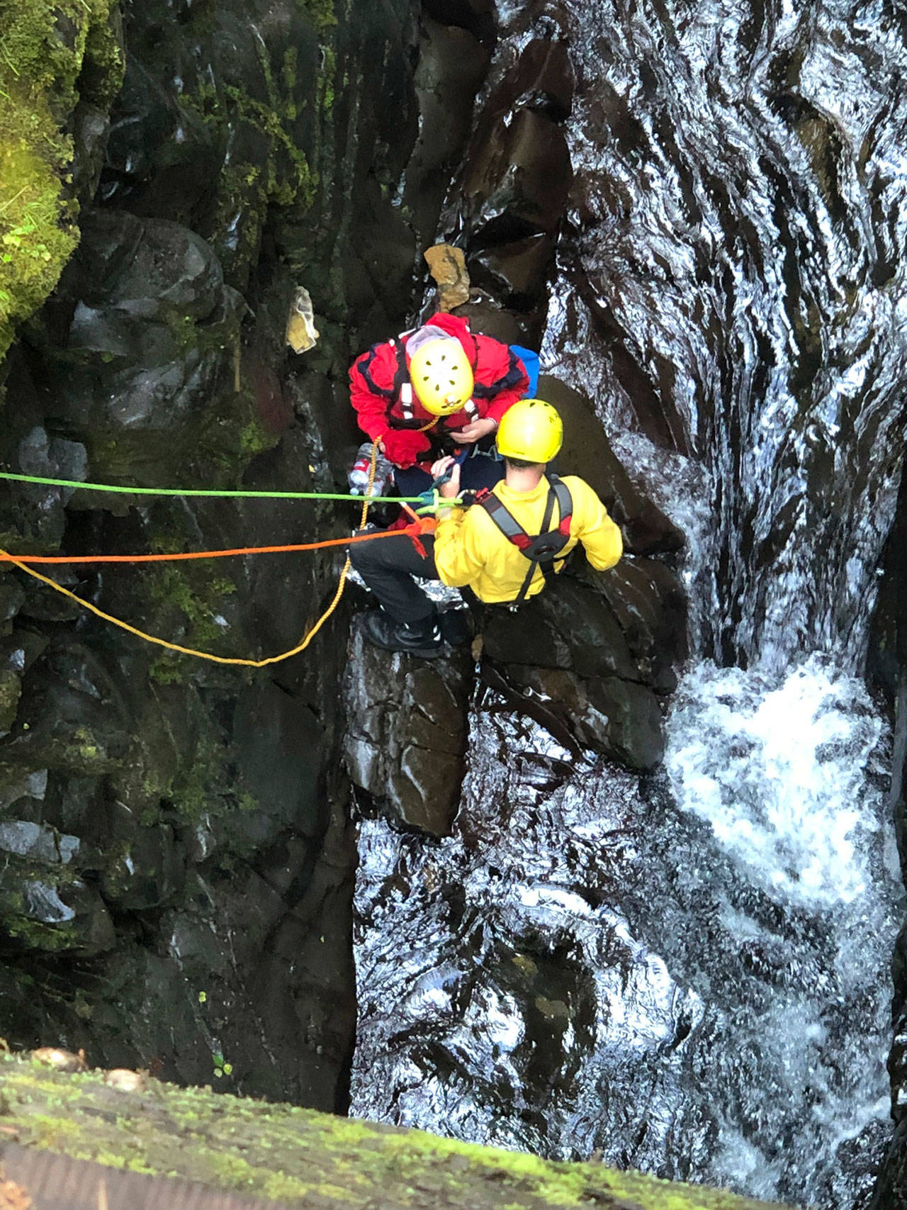 A first responder works to rescue a teenager who was trapped on a rock in the Sol Duc River on Monday. (Assistant Chief Dan Huff/Clallam County Fire District No. 2)
