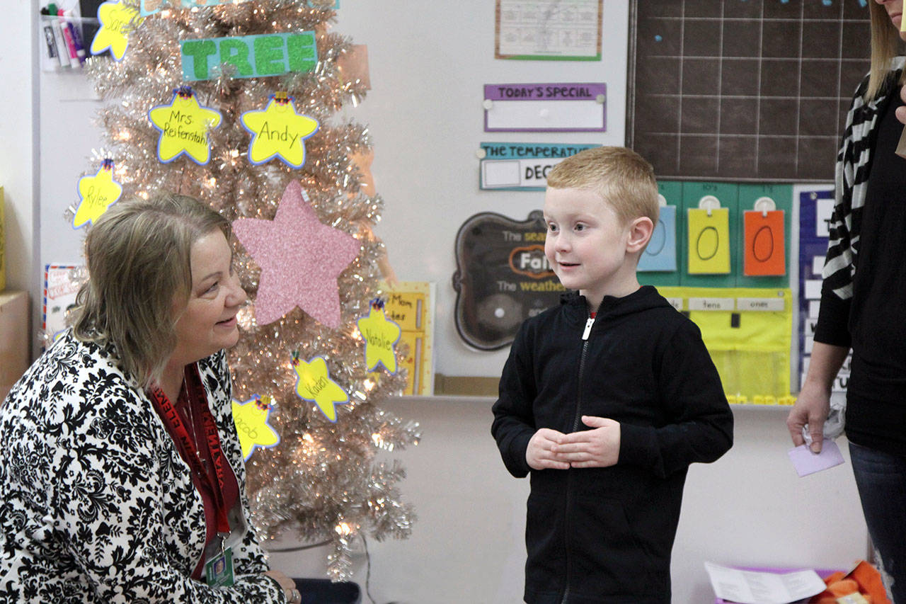 Janice Rhyne, a first-grade teacher at Franklin Elementary School in Port Angeles, meets Kaden Reeves for the first time Tuesday as school opens for another year. (Dave Logan/for Peninsula Daily News)