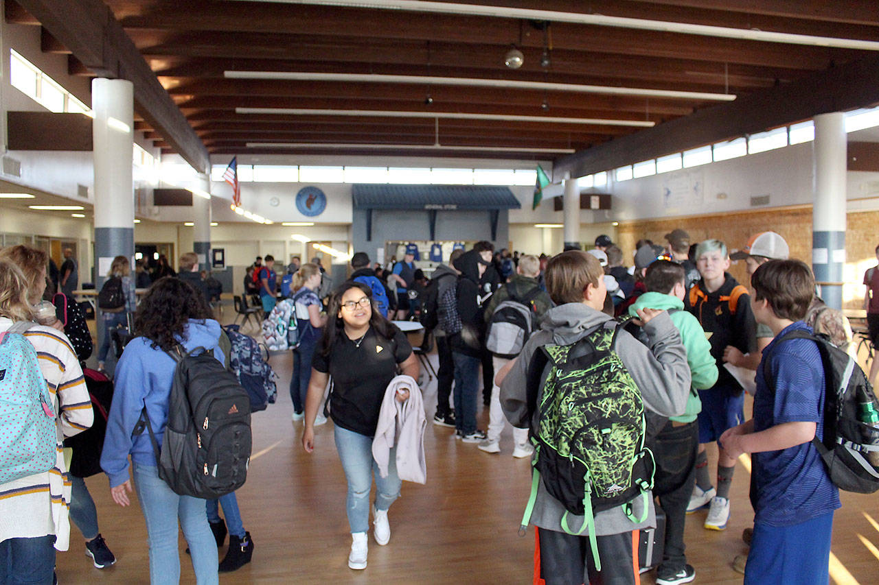 Chimacum High School students congregate in the school commons Tuesday as they wait for the bell to ring on the first day of school. (Zach Jablonski/Peninsula Daily News)