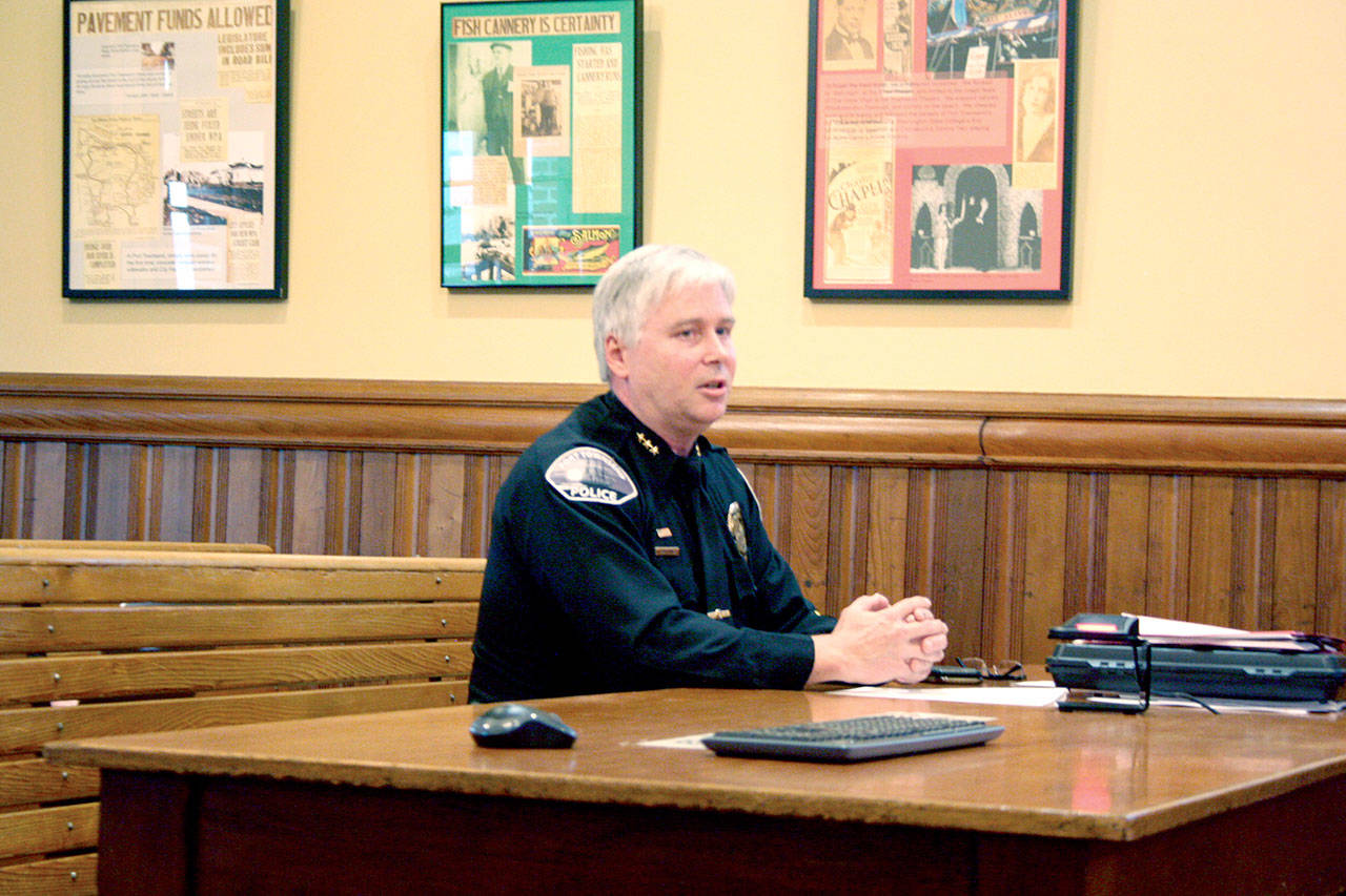 Port Townsend Police Chief Michael Evans breaks down the five-year costs of portable body cameras before City Council members. The 20 eye-level units would replace the vehicle-mounted systems the officers use now. (Brian McLean/Peninsula Daily News)