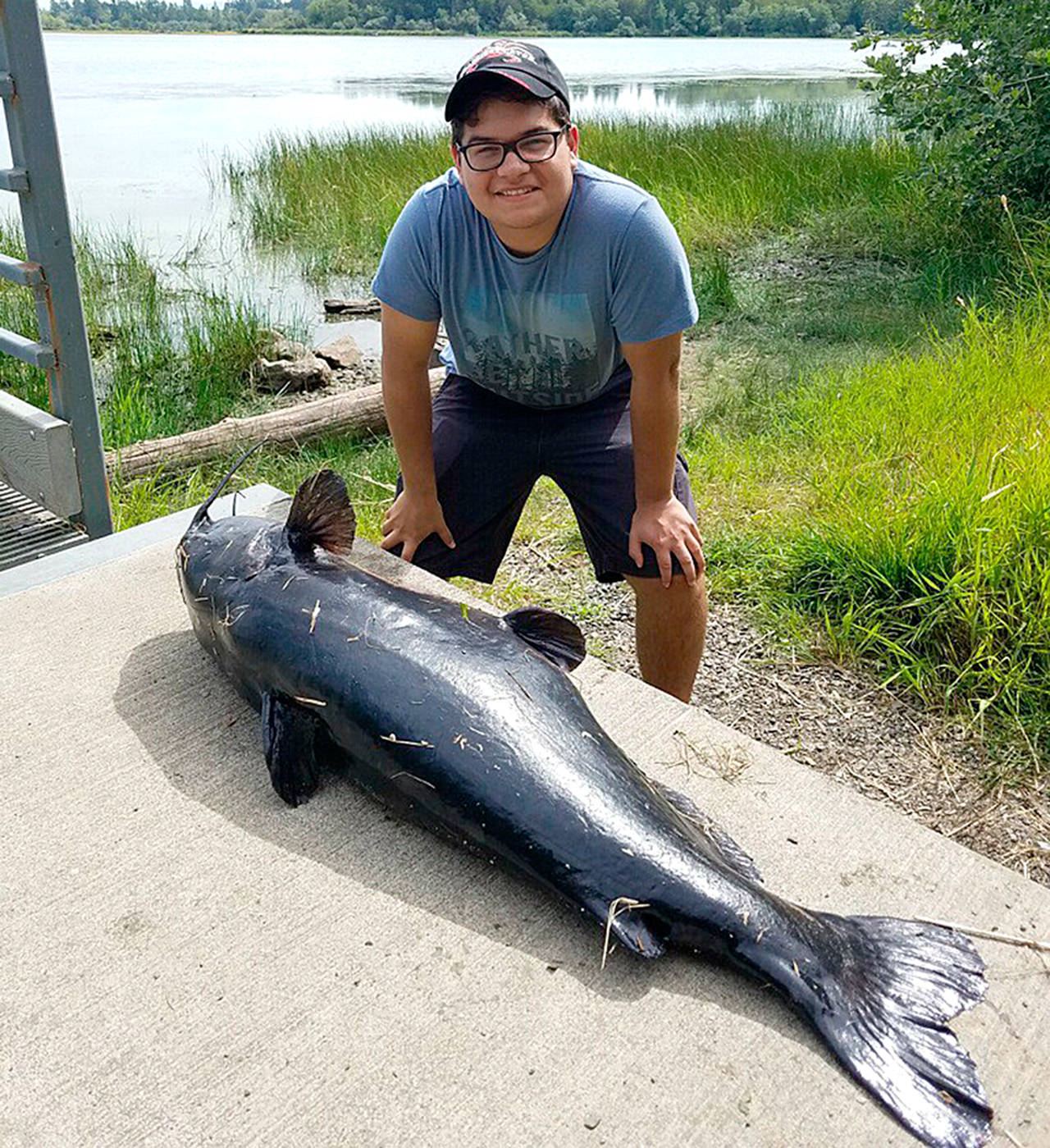State Department of Fish and Wildlife Blaines Cole Abshere set a new state record for channel catfish when he reeled in this 37.7-pounder on Lake Terrell in Whatcom County.