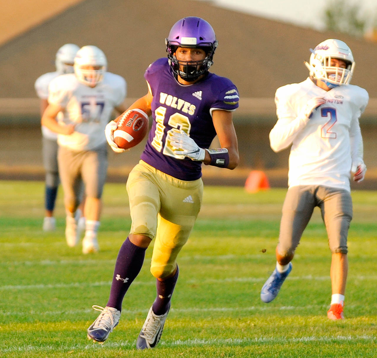 Michael Dashiell/Olympic Peninsula News Group Sequim wide receiver Hayden Eaton scored on this 45-yard pass from Taig Wiker in the Wolves 42-14 win over Washington.