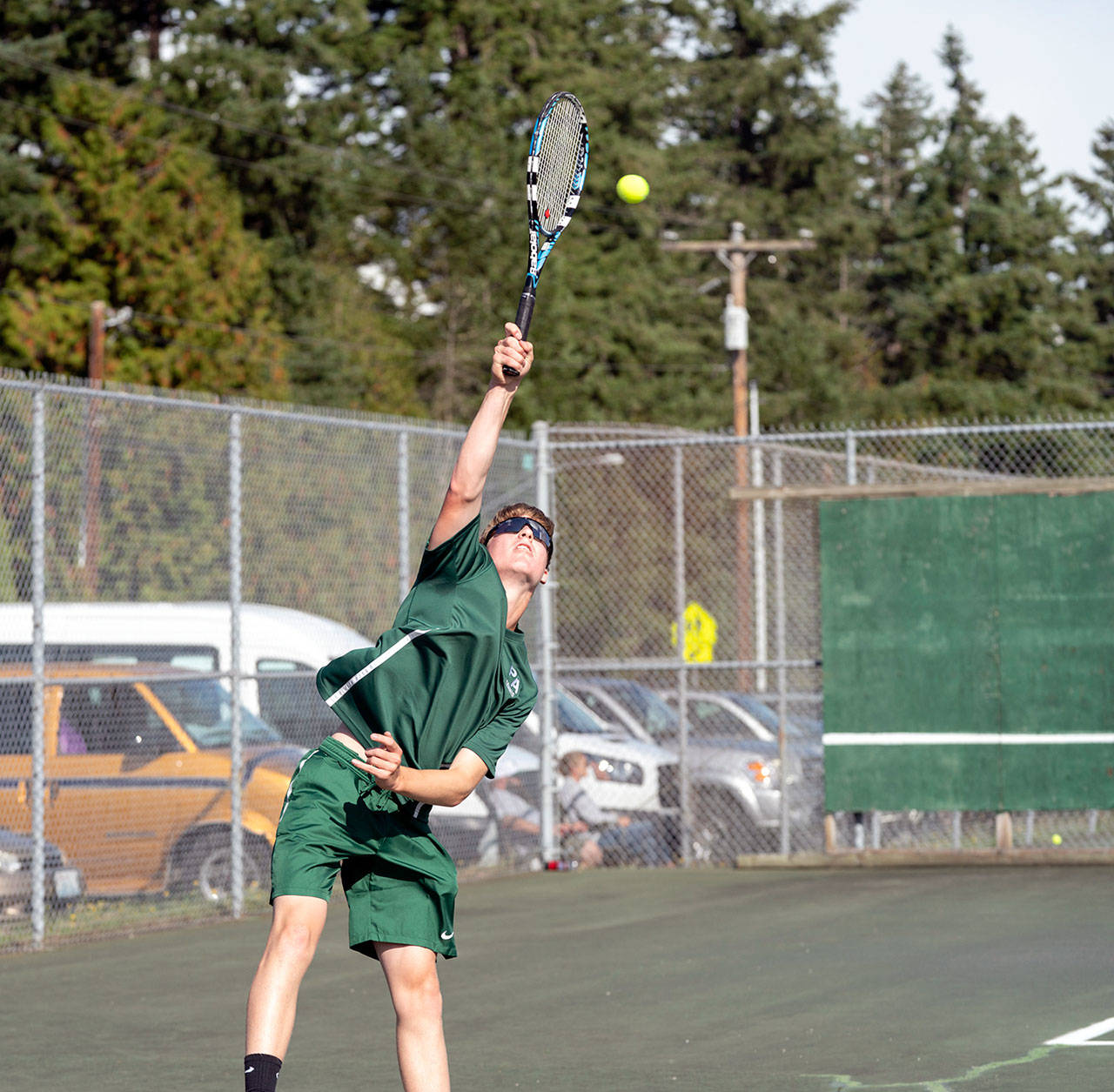 Port Angeles’ Wyatt Hall hits a serve during a match against Chimacum’s Rowan Powell on Tuesday in Chimacum. (Steve Mullensky/for Peninsula Daily News)